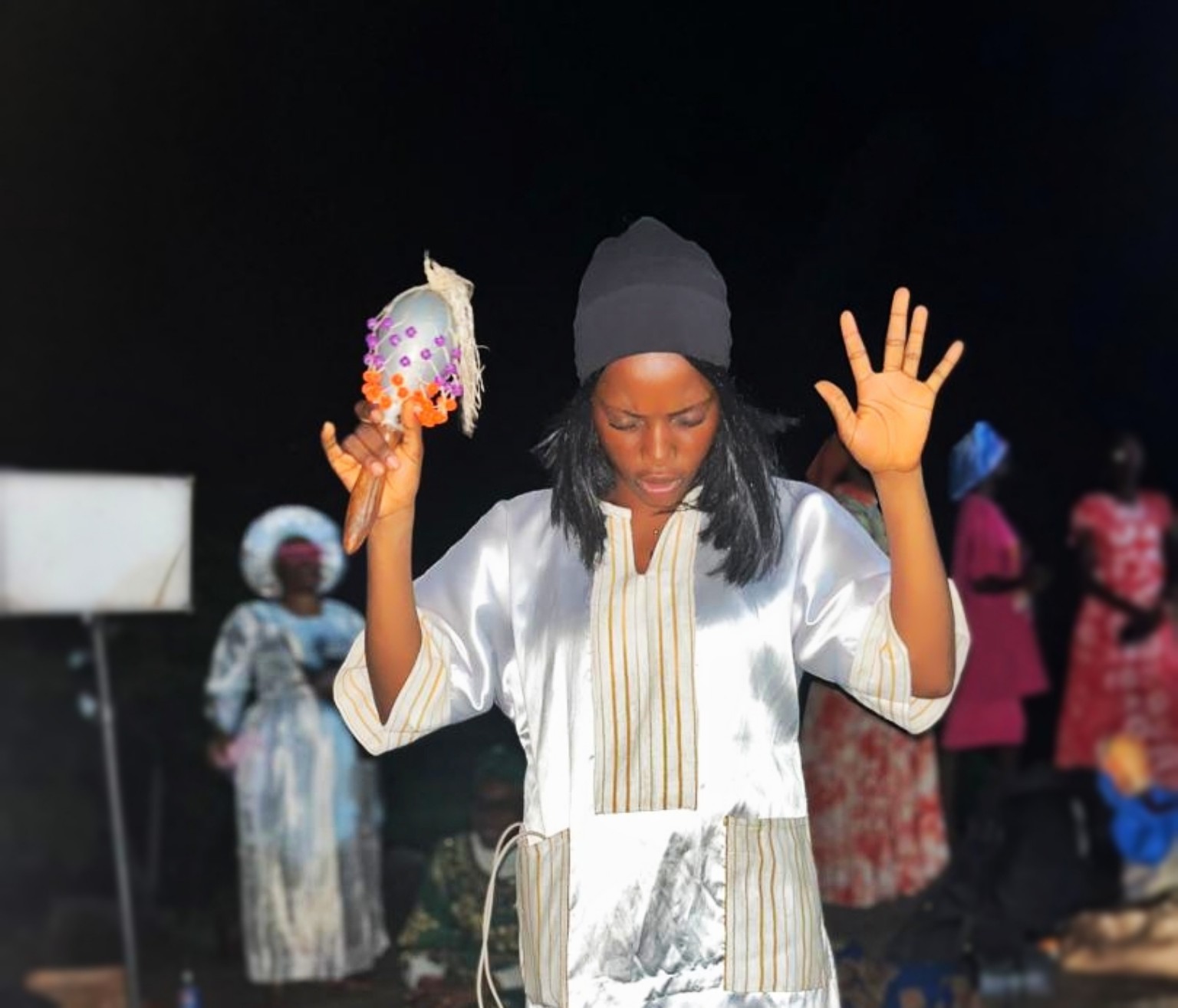Worshipper praising during an outdoor gathering